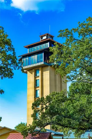a front view of a house with plants