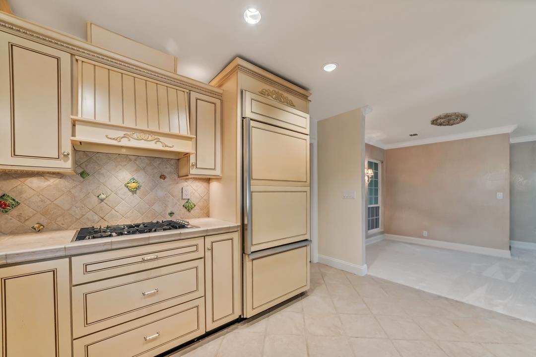 9971 Broadmoor Drive San Ramon, CA 94583 - Photo 12 of 35 a kitchen with a refrigerator and a stove top oven