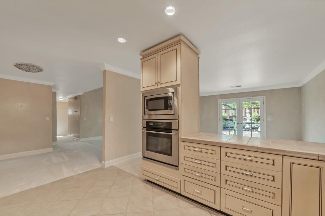 9971 Broadmoor Drive San Ramon, CA 94583 - Photo 13 of 35 a kitchen with stainless steel appliances granite countertop a refrigerator and a stove top oven