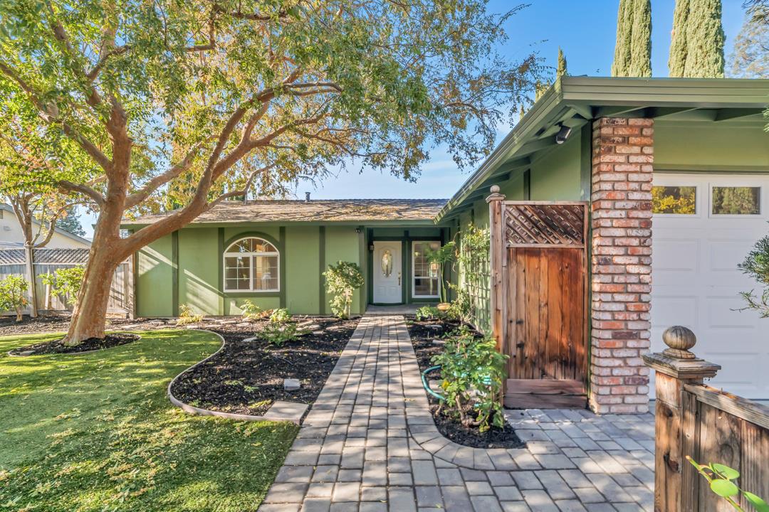 9971 Broadmoor Drive San Ramon, CA 94583 - Photo 2 of 35 a front view of a house with a garden and trees