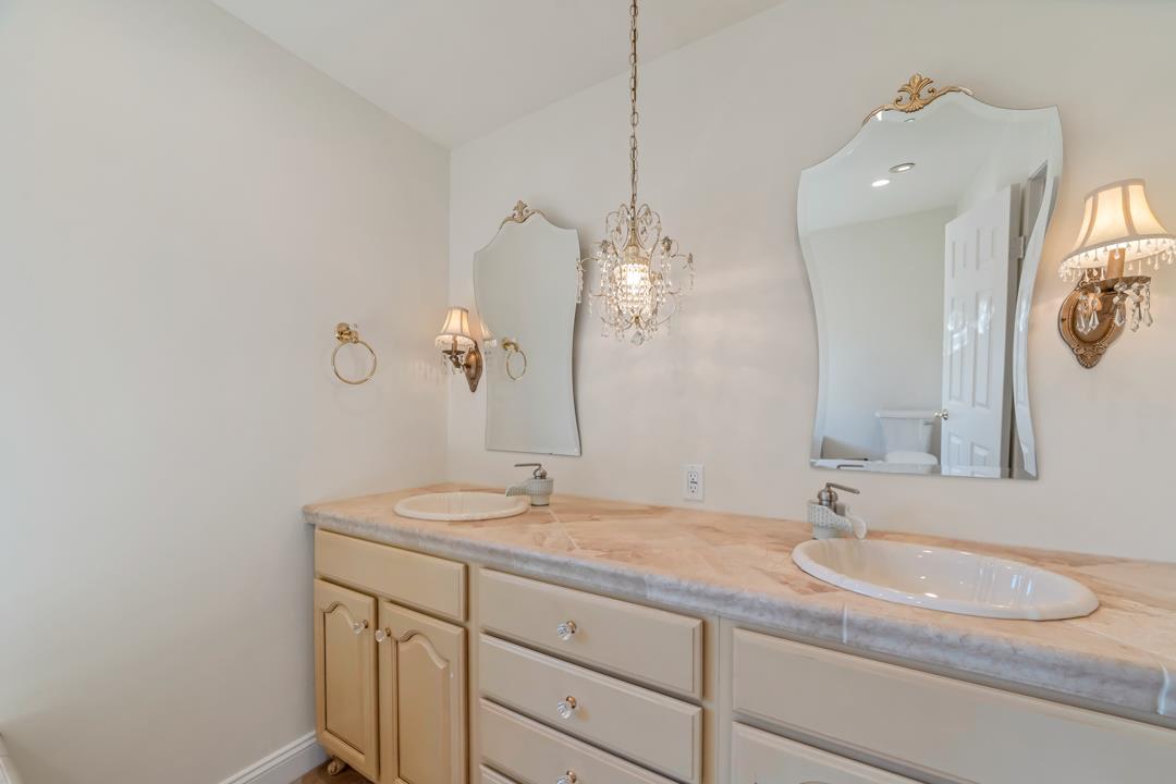 9971 Broadmoor Drive San Ramon, CA 94583 - Photo 28 of 35 a bathroom with a sink and a mirror