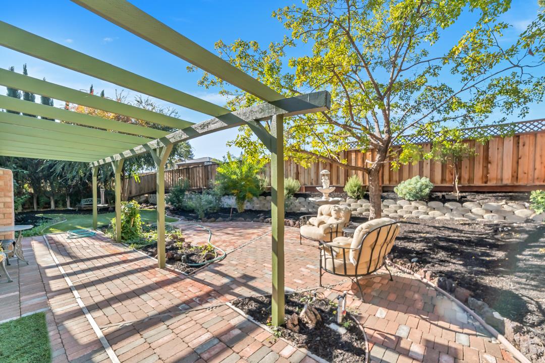 9971 Broadmoor Drive San Ramon, CA 94583 - Photo 29 of 35 a view of a patio with a table and chairs under an umbrella