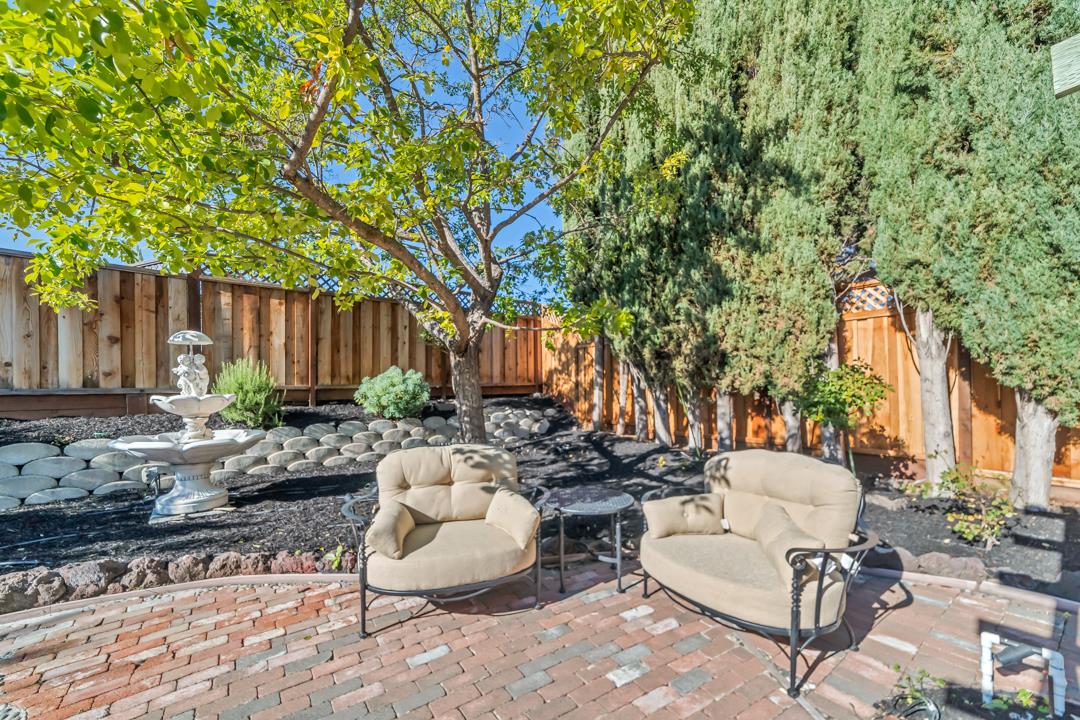 9971 Broadmoor Drive San Ramon, CA 94583 - Photo 33 of 35 a view of a patio with couches and chairs under an umbrella