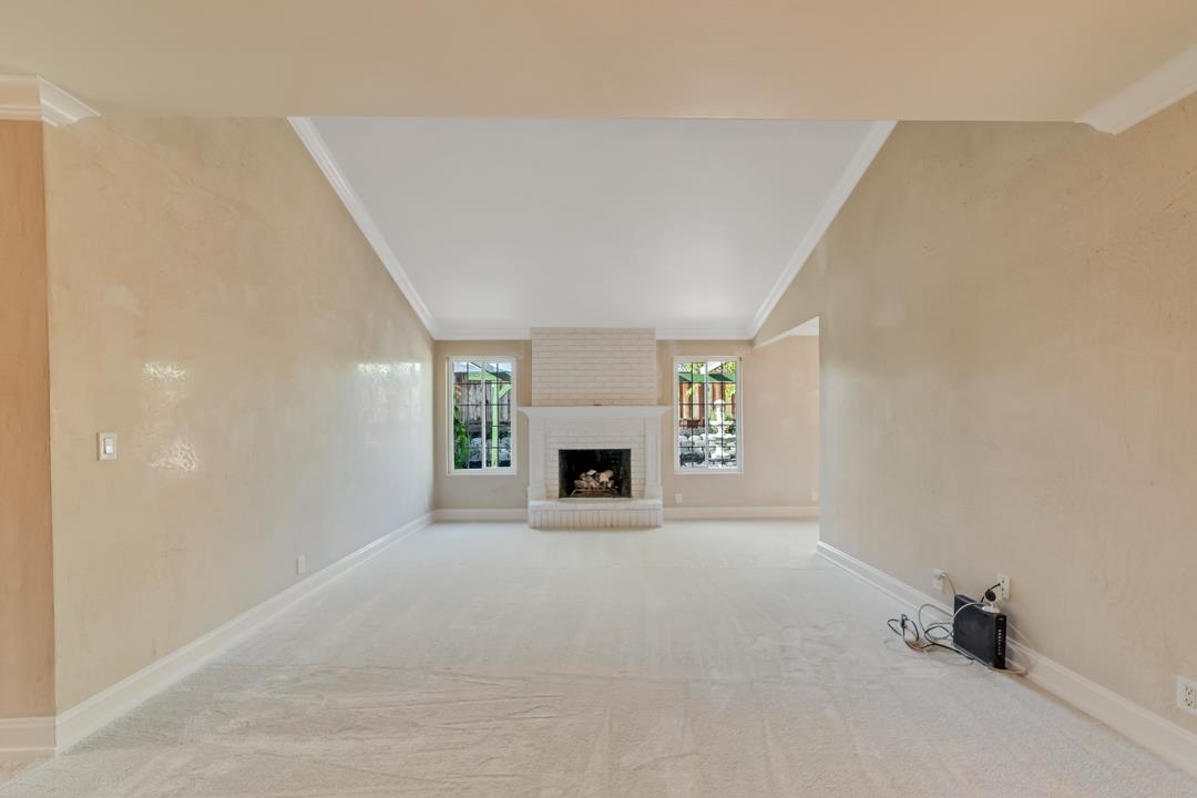 9971 Broadmoor Drive San Ramon, CA 94583 - Photo 5 of 35 a view of an empty room with a fireplace and a window