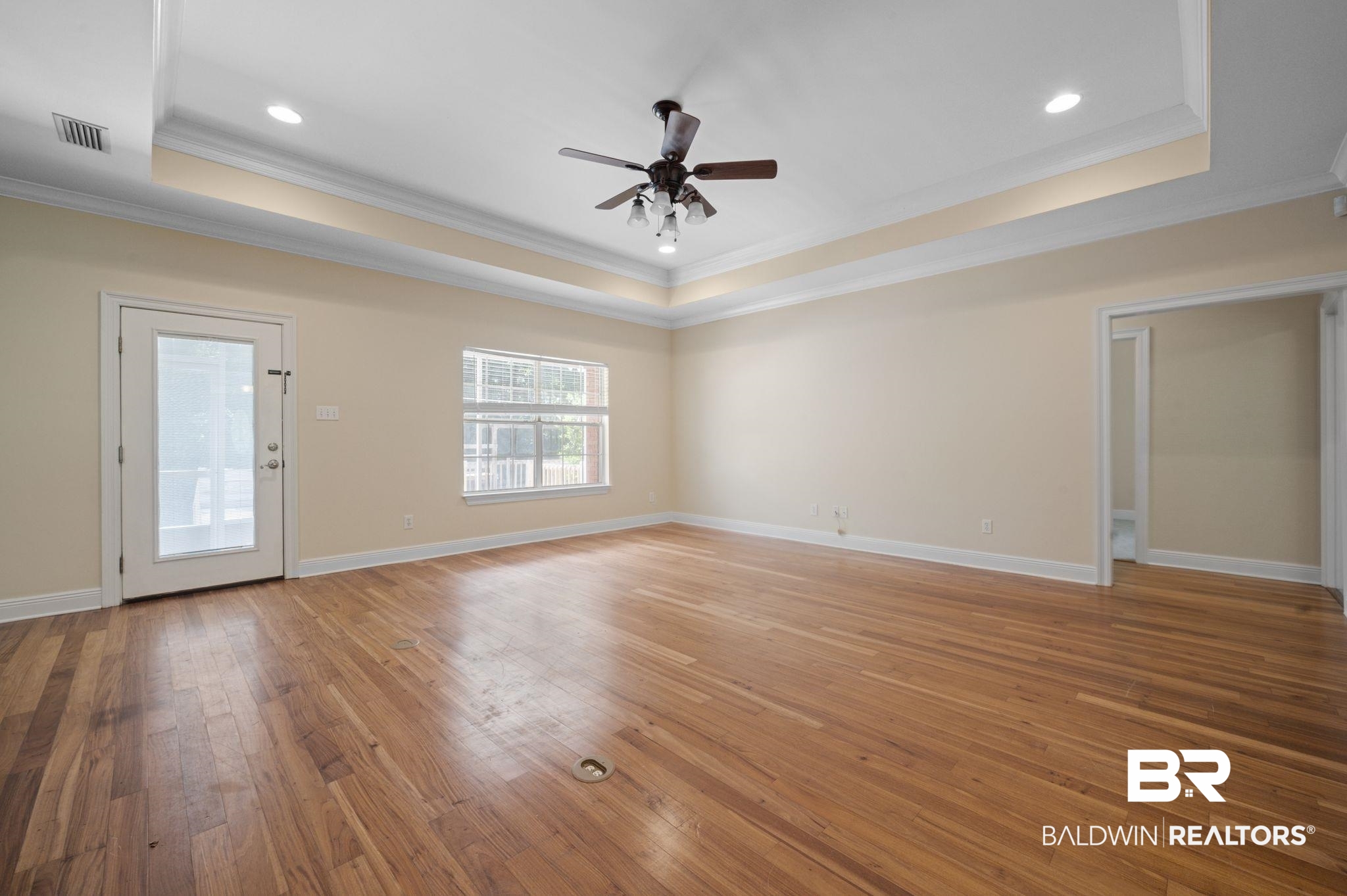 2041 Ridgeline Drive Mobile, AL 36695 - Photo 28 of 43 Spare room with wood-type flooring, a raised ceiling, ornamental molding, and ceiling fan