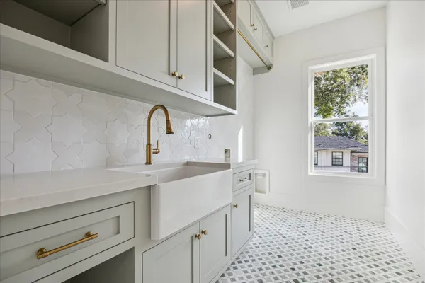 a kitchen with a sink and cabinets