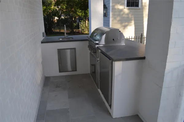 a kitchen with a sink and a mirror