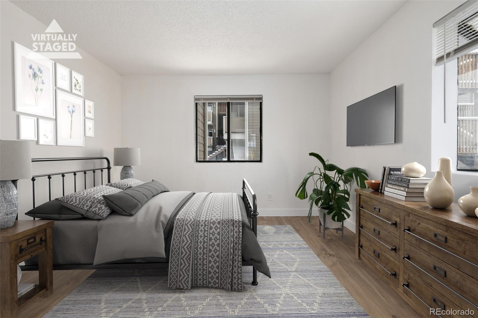 2929 West Floyd Avenue, Unit 201 Denver, CO 80236 - Photo 15 of 28 a living room with furniture potted plant and a window