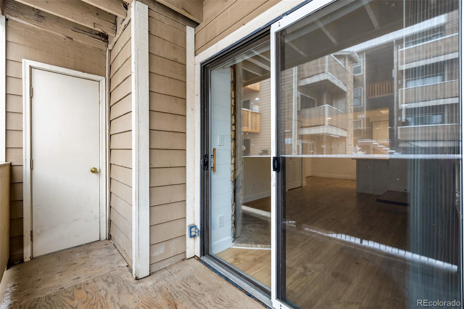 2929 West Floyd Avenue, Unit 201 Denver, CO 80236 - Photo 24 of 28 a view of front door