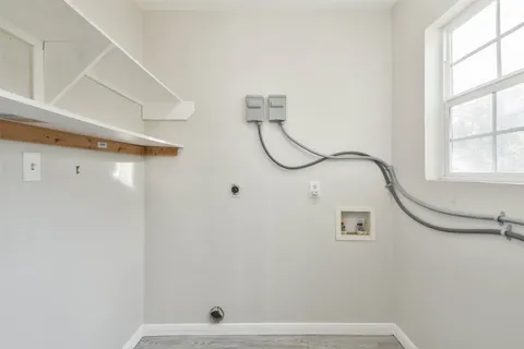 a bathroom with a shower and a window