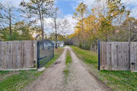 a view of an house with backyard space and balcony