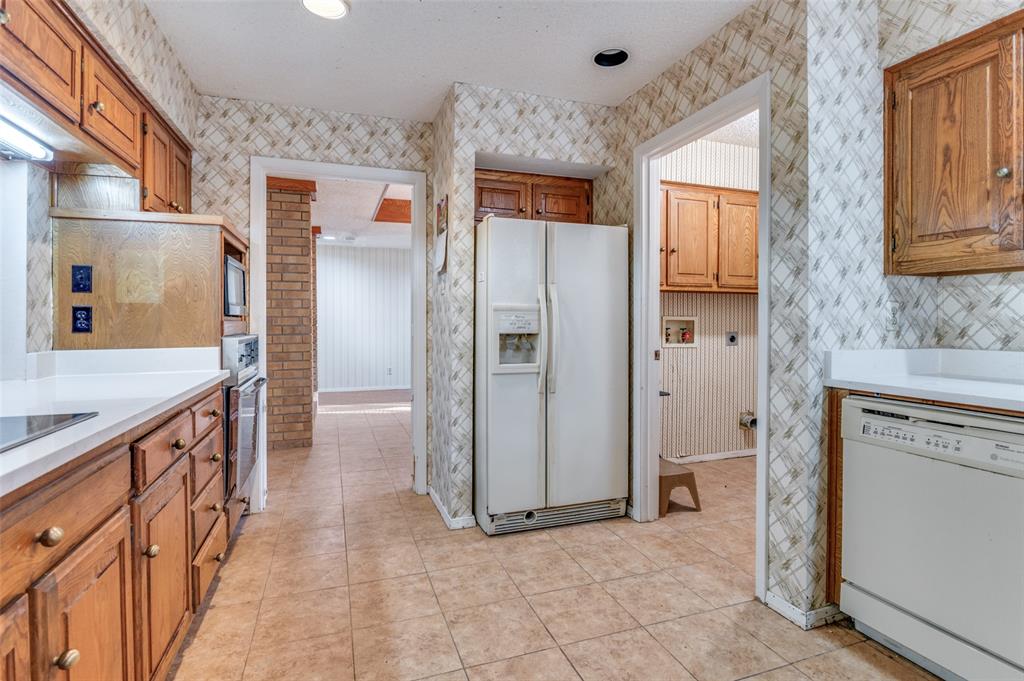 3008 Old Mill Run Grapevine, TX 76051 - Photo 13 of 38 a view of a kitchen with wooden floor and a sink