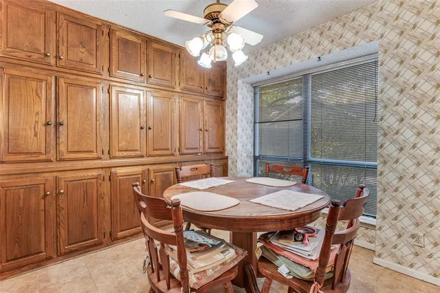 a dinning table and chairs in a room