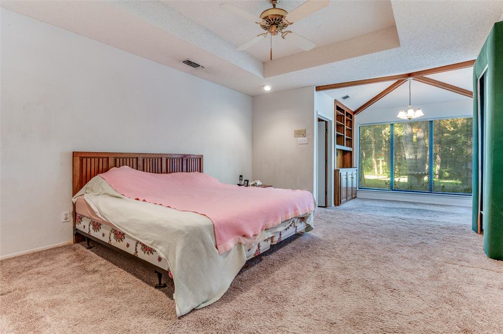 3008 Old Mill Run Grapevine, TX 76051 - Photo 22 of 38 a bed room with a bed and a large mirror