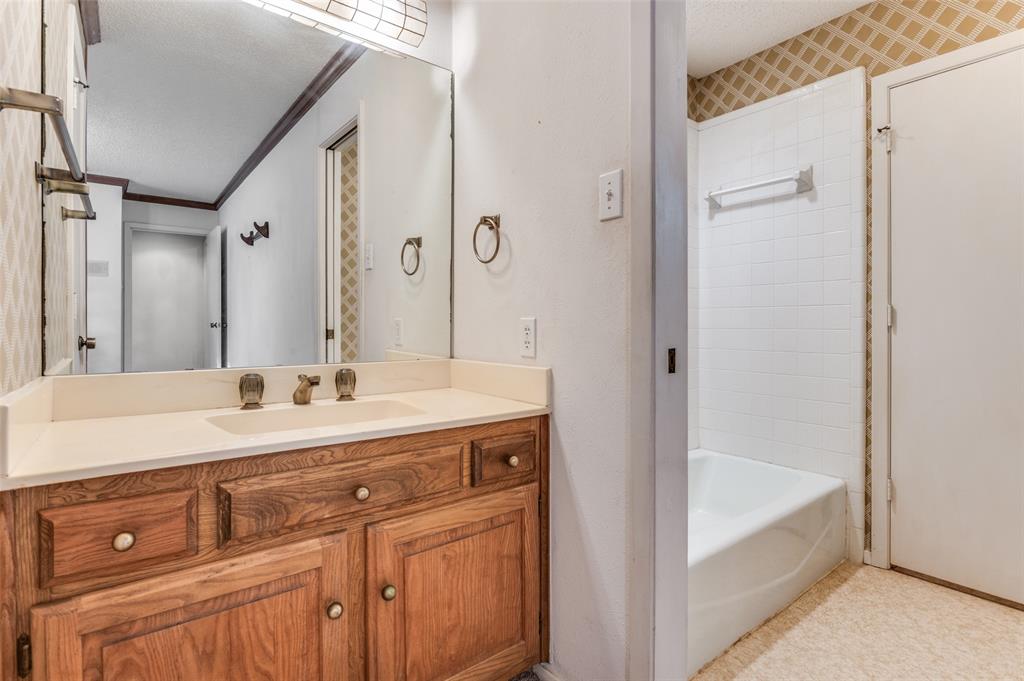 3008 Old Mill Run Grapevine, TX 76051 - Photo 27 of 38 a spacious bathroom with a tub sink and mirror