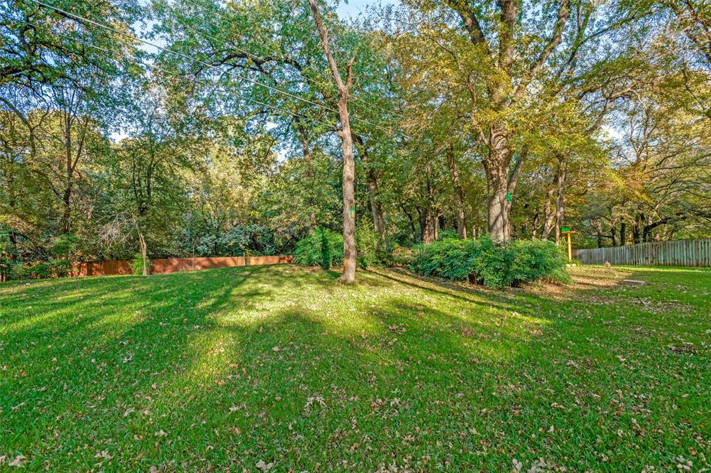 3008 Old Mill Run Grapevine, TX 76051 - Photo 31 of 38 a view of green field with trees in the background