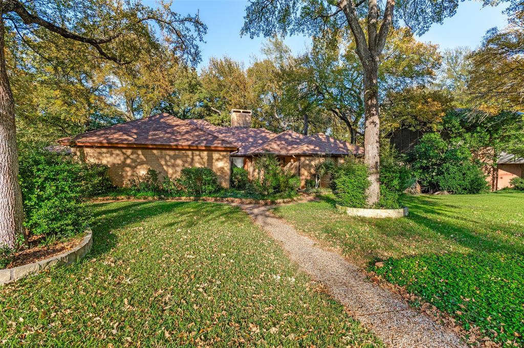 3008 Old Mill Run Grapevine, TX 76051 - Photo 33 of 38 a view of a backyard with plants and large trees