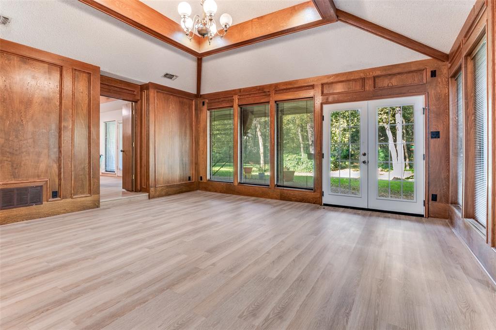 3008 Old Mill Run Grapevine, TX 76051 - Photo 5 of 38 a view of an empty room with wooden floor and walls