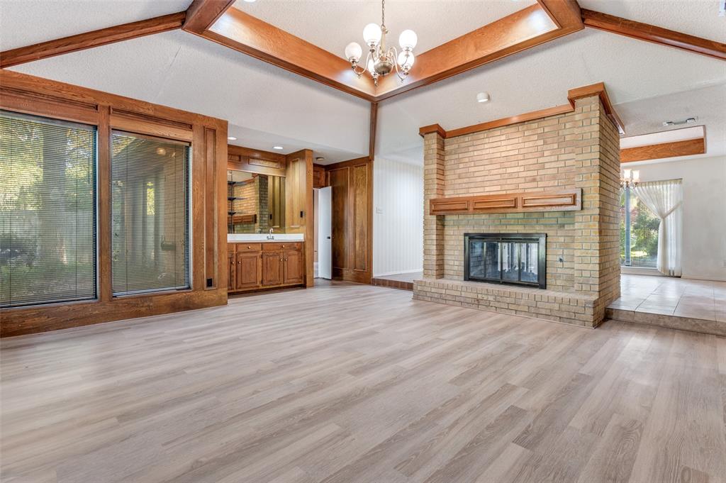 3008 Old Mill Run Grapevine, TX 76051 - Photo 7 of 38 a view of empty room with wooden floor and fireplace