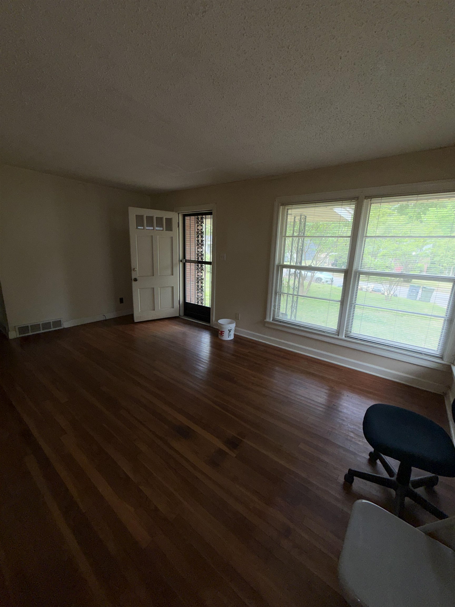 974 Tatum Road Memphis, TN 38122 - Photo 3 of 11 Living area with a textured ceiling and dark wood finished floors