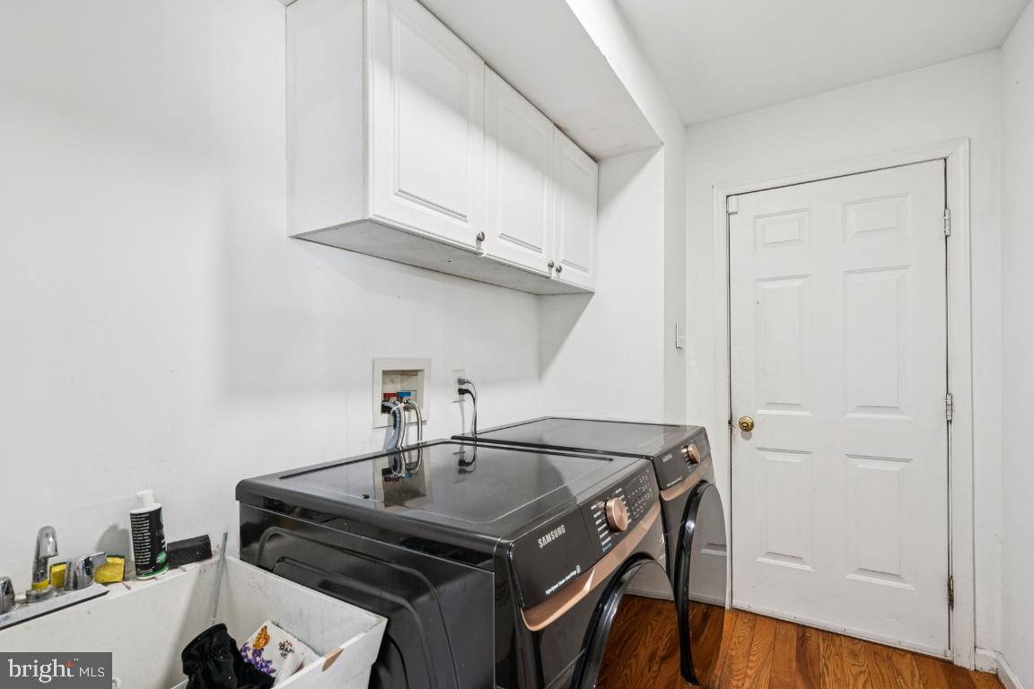 902 Rural Avenue Voorhees, NJ 08043 - Photo 12 of 25 a kitchen with a sink a cabinets and wooden floor