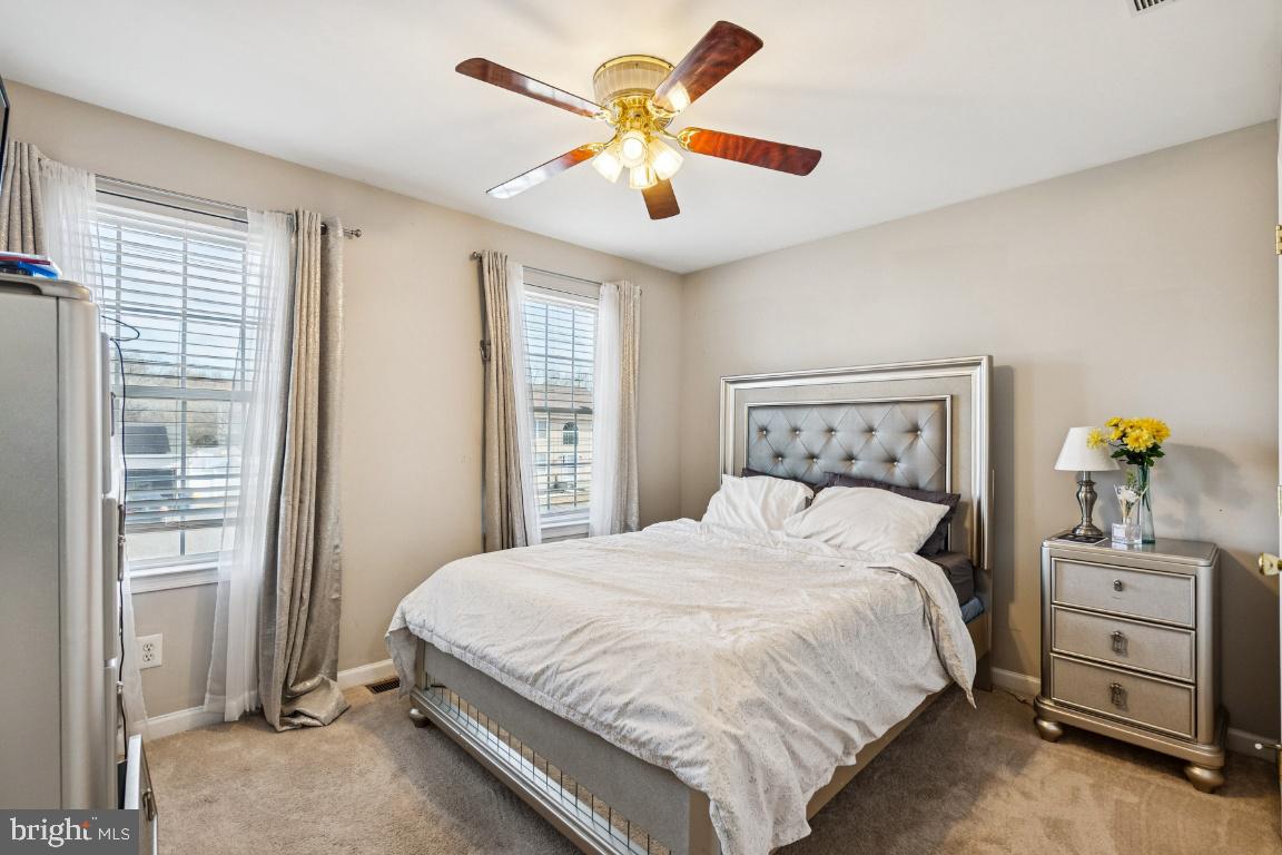 902 Rural Avenue Voorhees, NJ 08043 - Photo 15 of 25 a bedroom with a bed and a chandelier