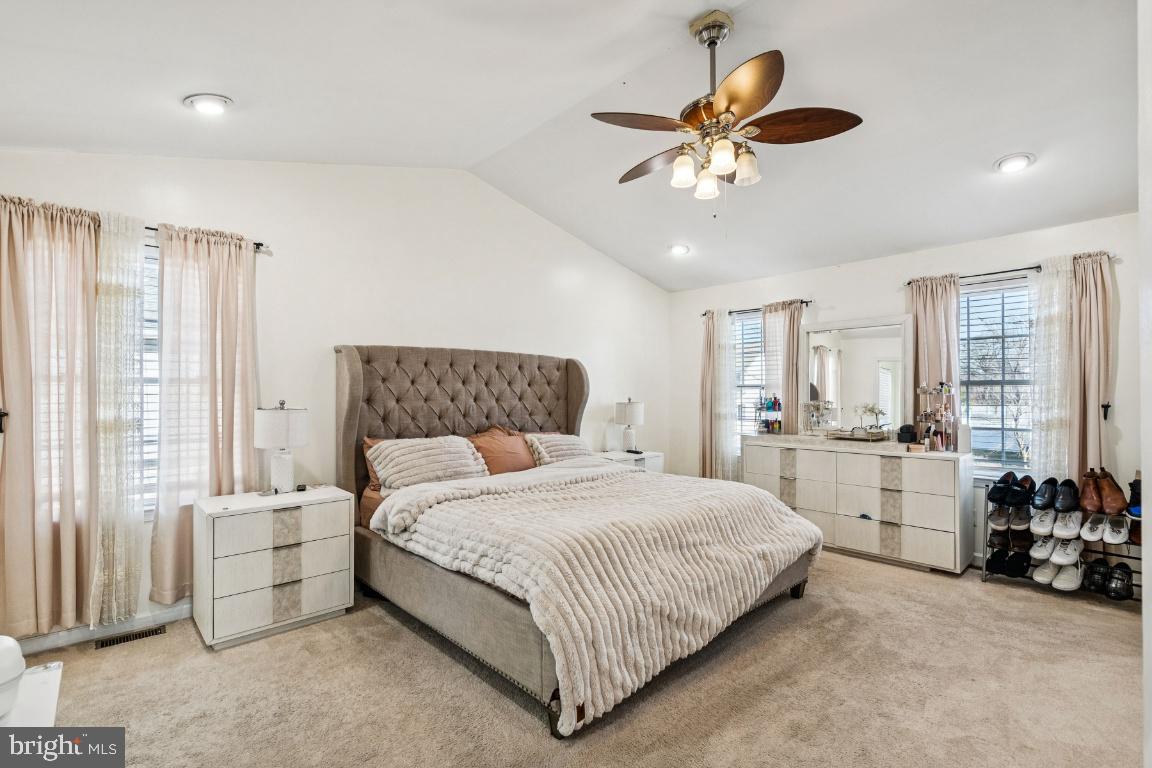 902 Rural Avenue Voorhees, NJ 08043 - Photo 19 of 25 a bedroom with a bed a large window and a chandelier