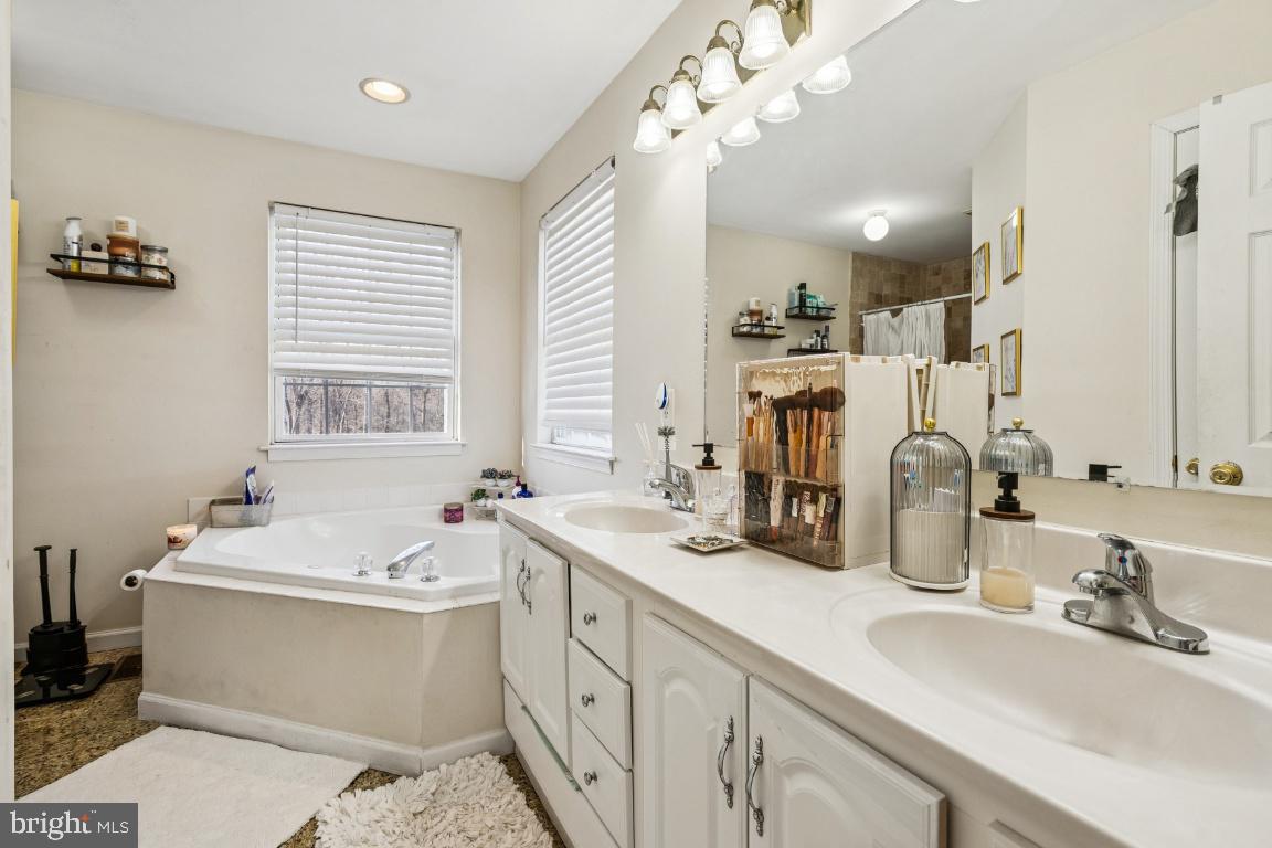 902 Rural Avenue Voorhees, NJ 08043 - Photo 20 of 25 a bathroom with a double vanity sink mirror and double