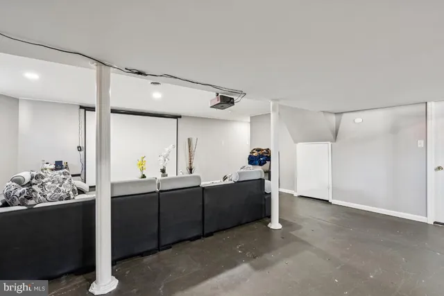 a bathroom with a granite countertop sink toilet and mirror