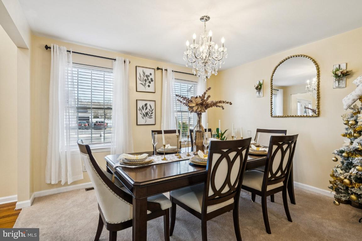 902 Rural Avenue Voorhees, NJ 08043 - Photo 5 of 25 a view of a dining room with furniture a chandelier and window