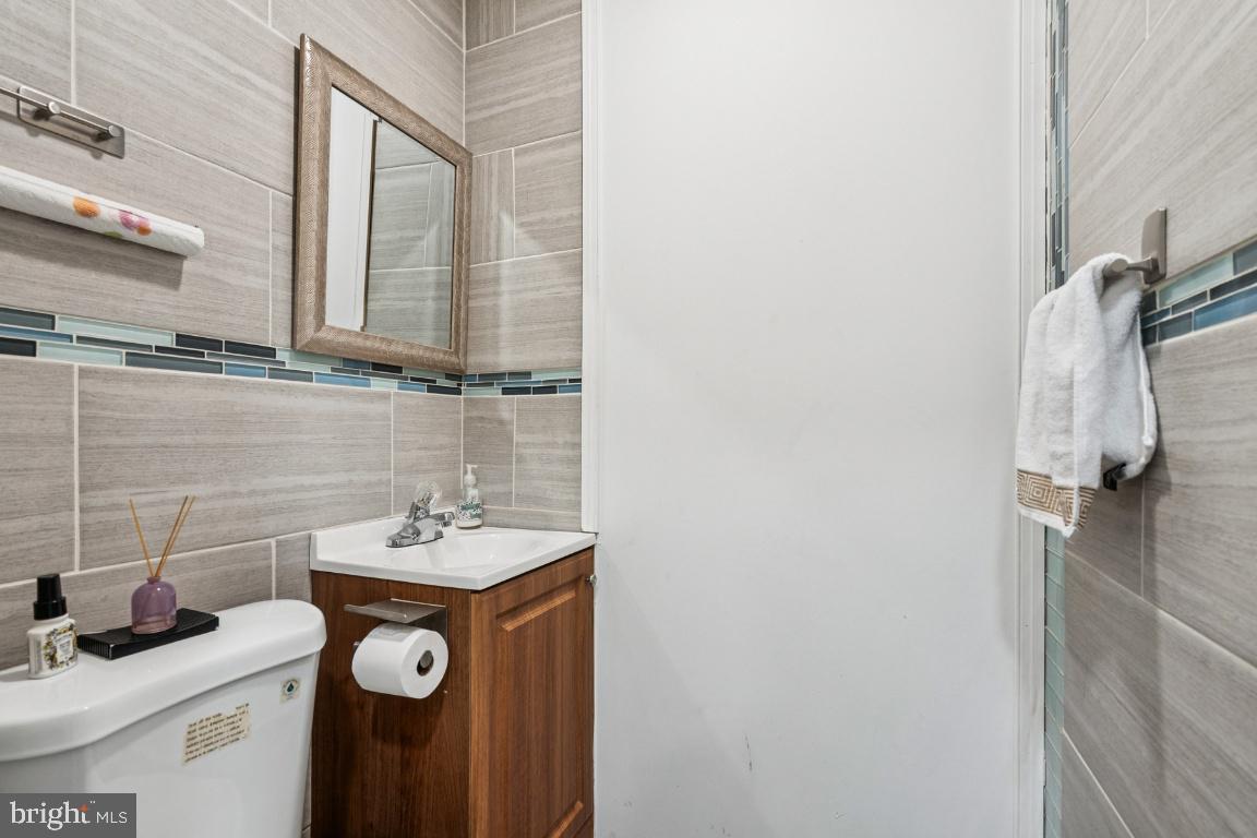 902 Rural Avenue Voorhees, NJ 08043 - Photo 8 of 25 a bathroom with a sink and a mirror