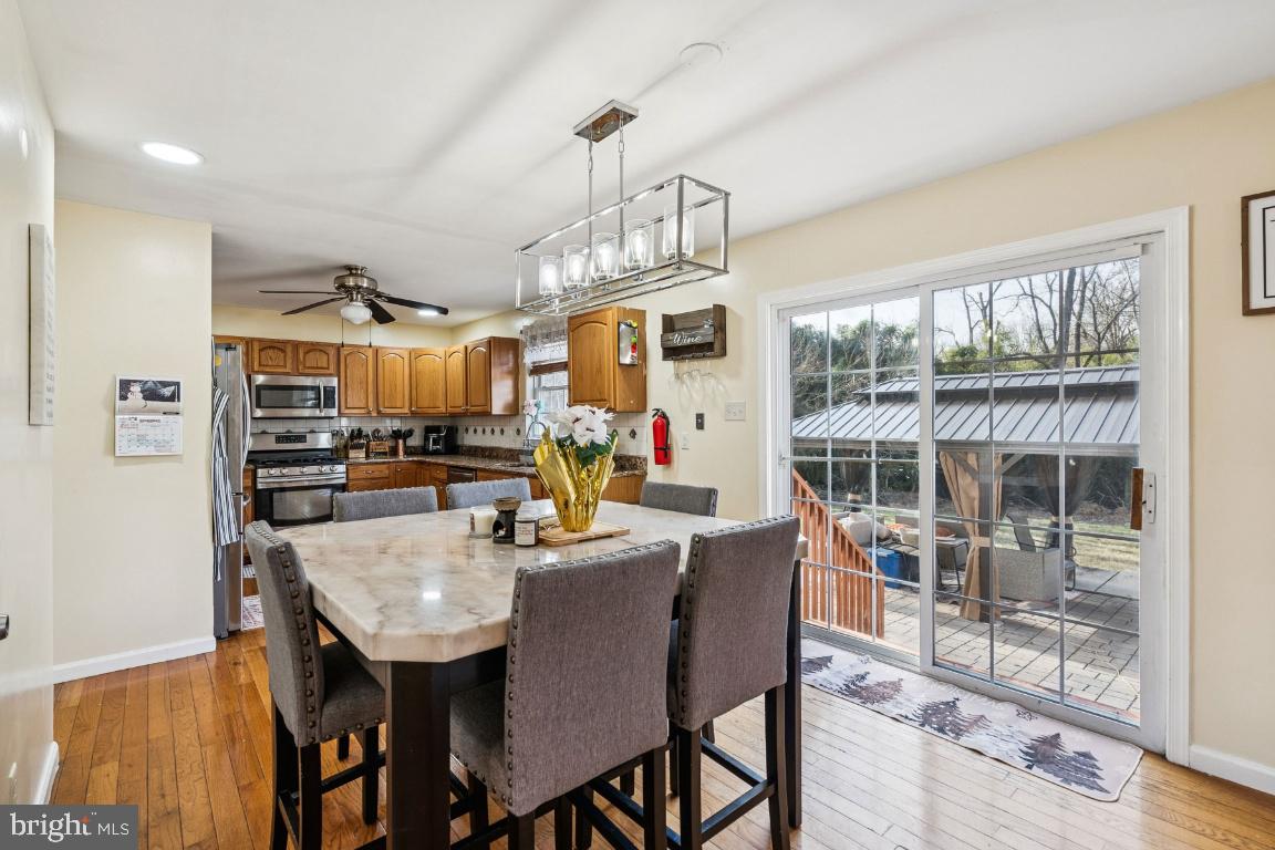 902 Rural Avenue Voorhees, NJ 08043 - Photo 9 of 25 a view of a dining room with furniture wooden floor and a chandelier