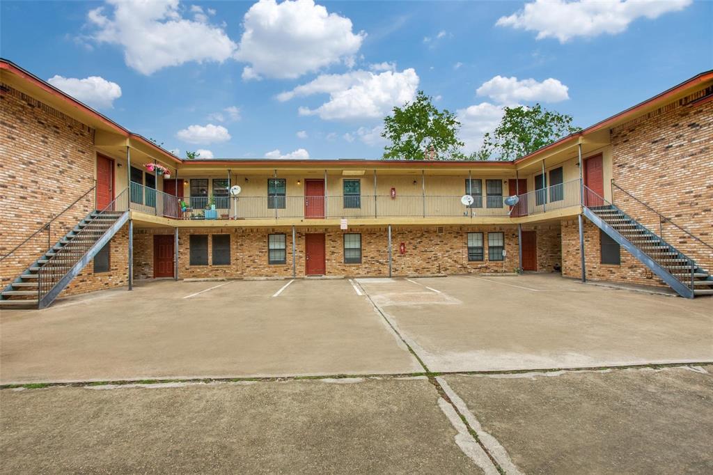 1108 North Elm Street, Unit 3 Denton, TX 76201 - Photo 2 of 15 a front view of a house with a yard