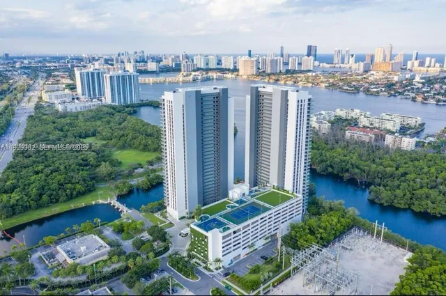 a bedroom with a bed and large window