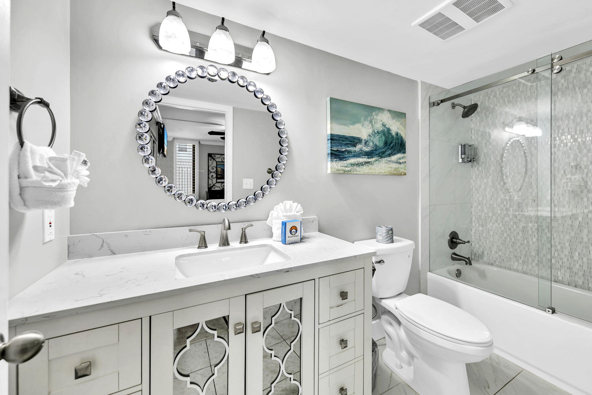 1044 Highway 98, Unit 101 Destin, FL 32541 - Photo 14 of 33 a bathroom with a sink a toilet and shower