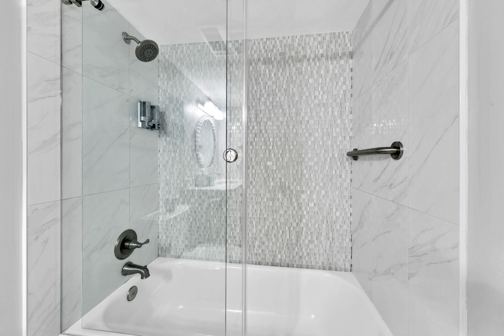 1044 Highway 98, Unit 101 Destin, FL 32541 - Photo 15 of 33 a bathroom with a shower and a bath tub