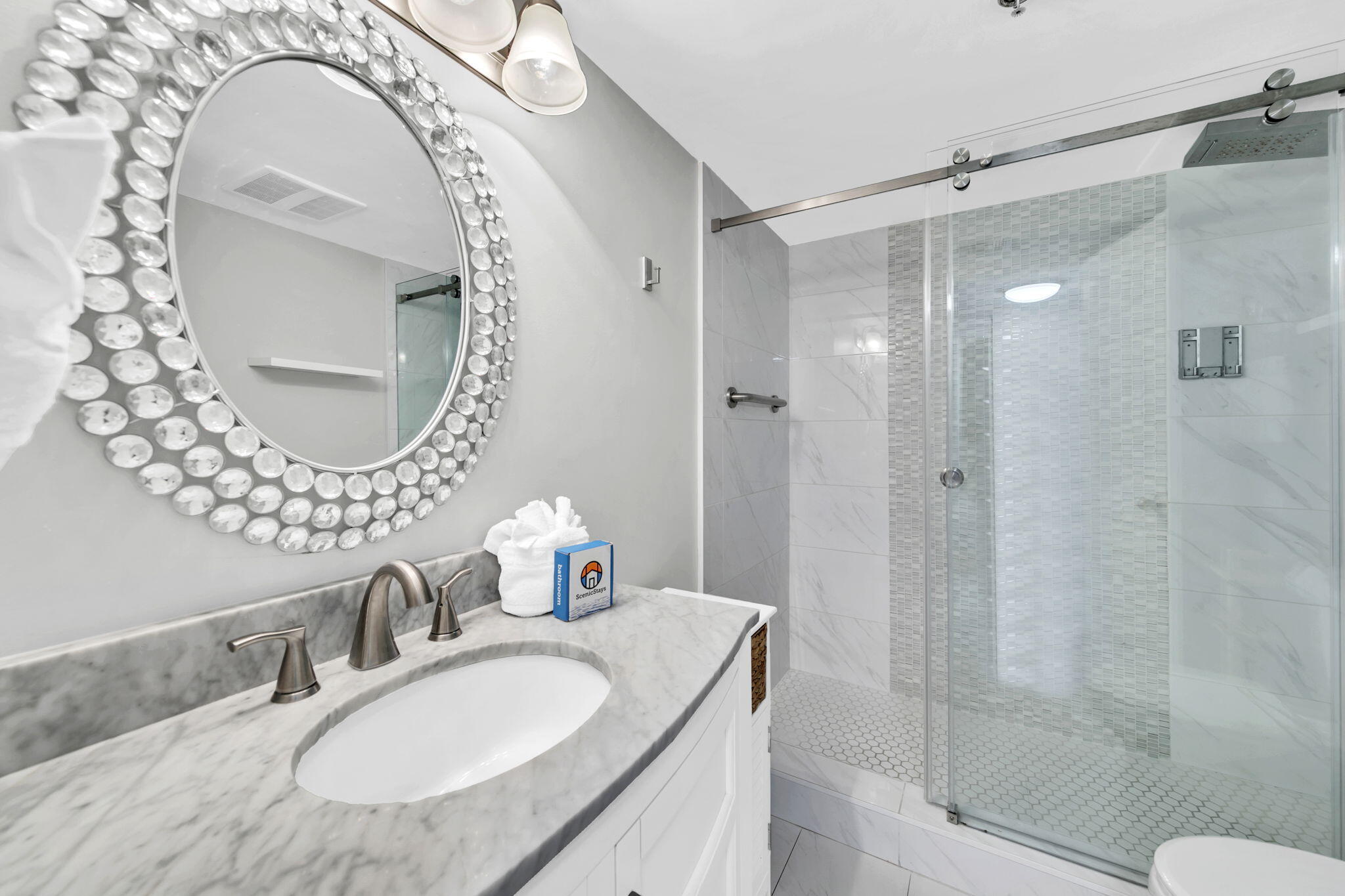 1044 Highway 98, Unit 101 Destin, FL 32541 - Photo 19 of 33 a bathroom with a sink and a mirror
