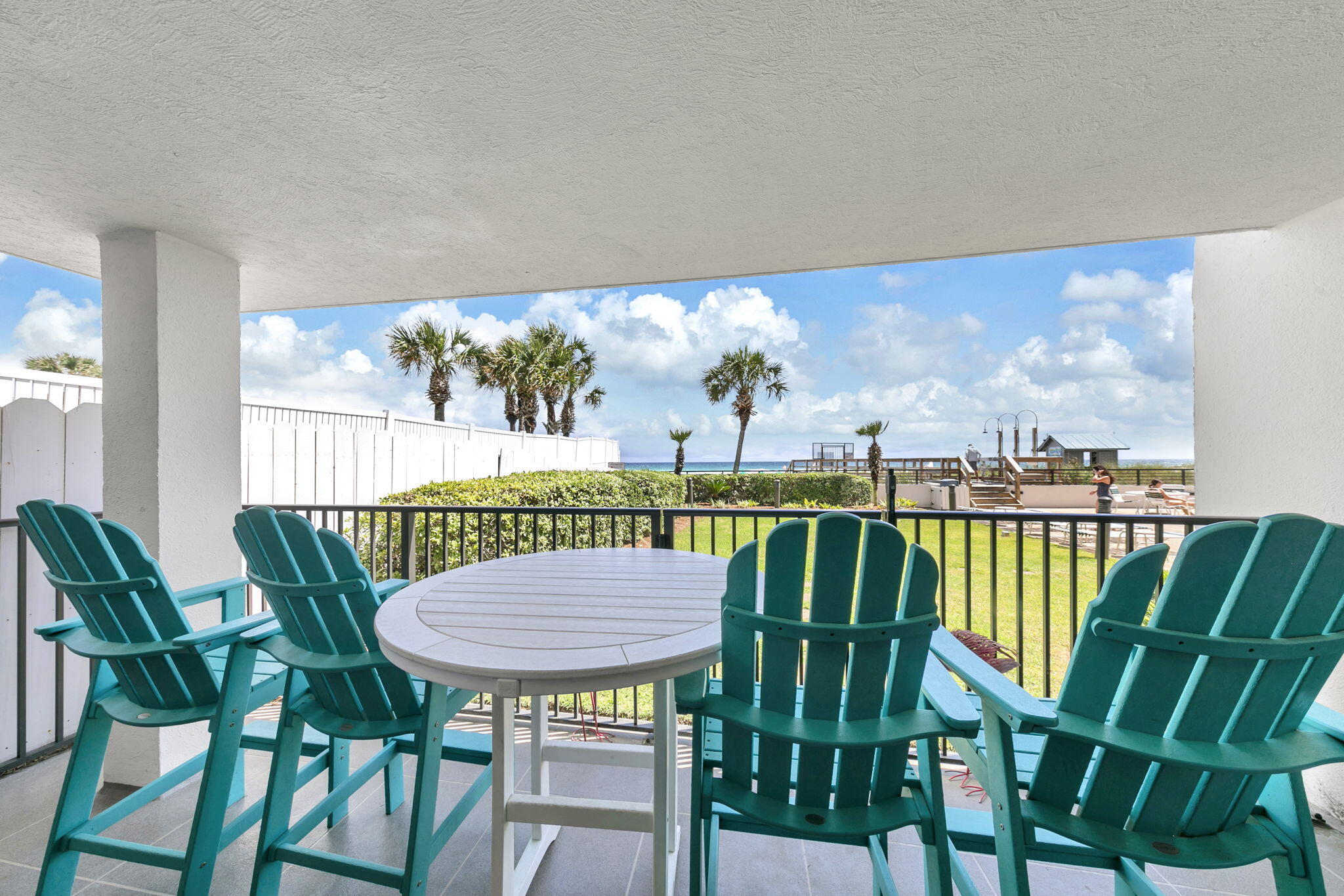 1044 Highway 98, Unit 101 Destin, FL 32541 - Photo 22 of 33 a view of a chairs and table in patio