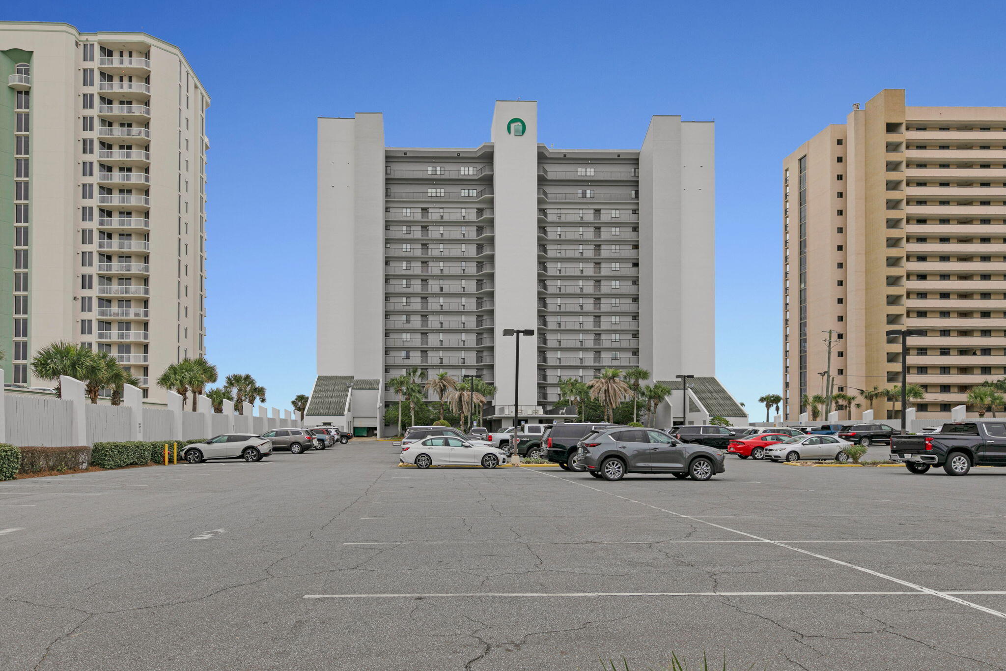 1044 Highway 98, Unit 101 Destin, FL 32541 - Photo 25 of 33 a building with cars parked in front of it