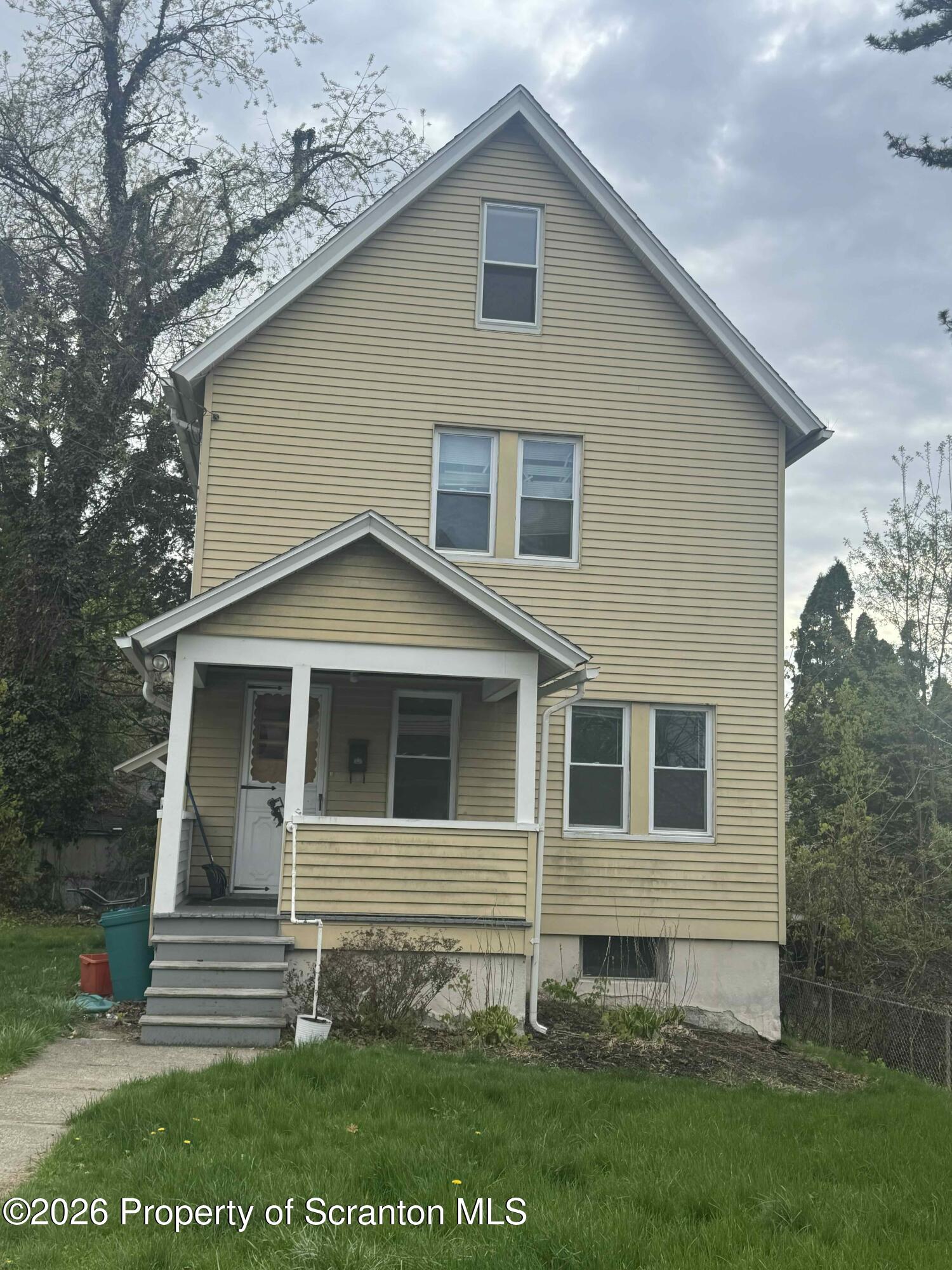 1116 Fairfield Street Scranton, PA 18509 - Photo 1 of 11 a front view of a house with a garden