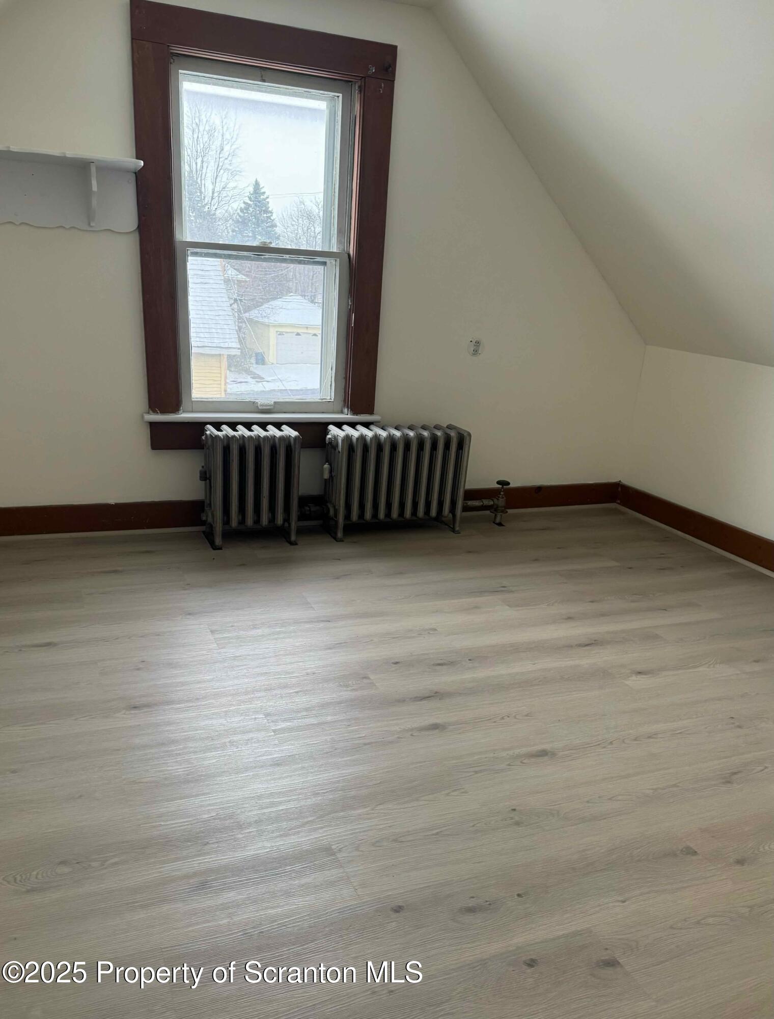 1116 Fairfield Street Scranton, PA 18509 - Photo 10 of 11 a view of a room with wooden floor and windows