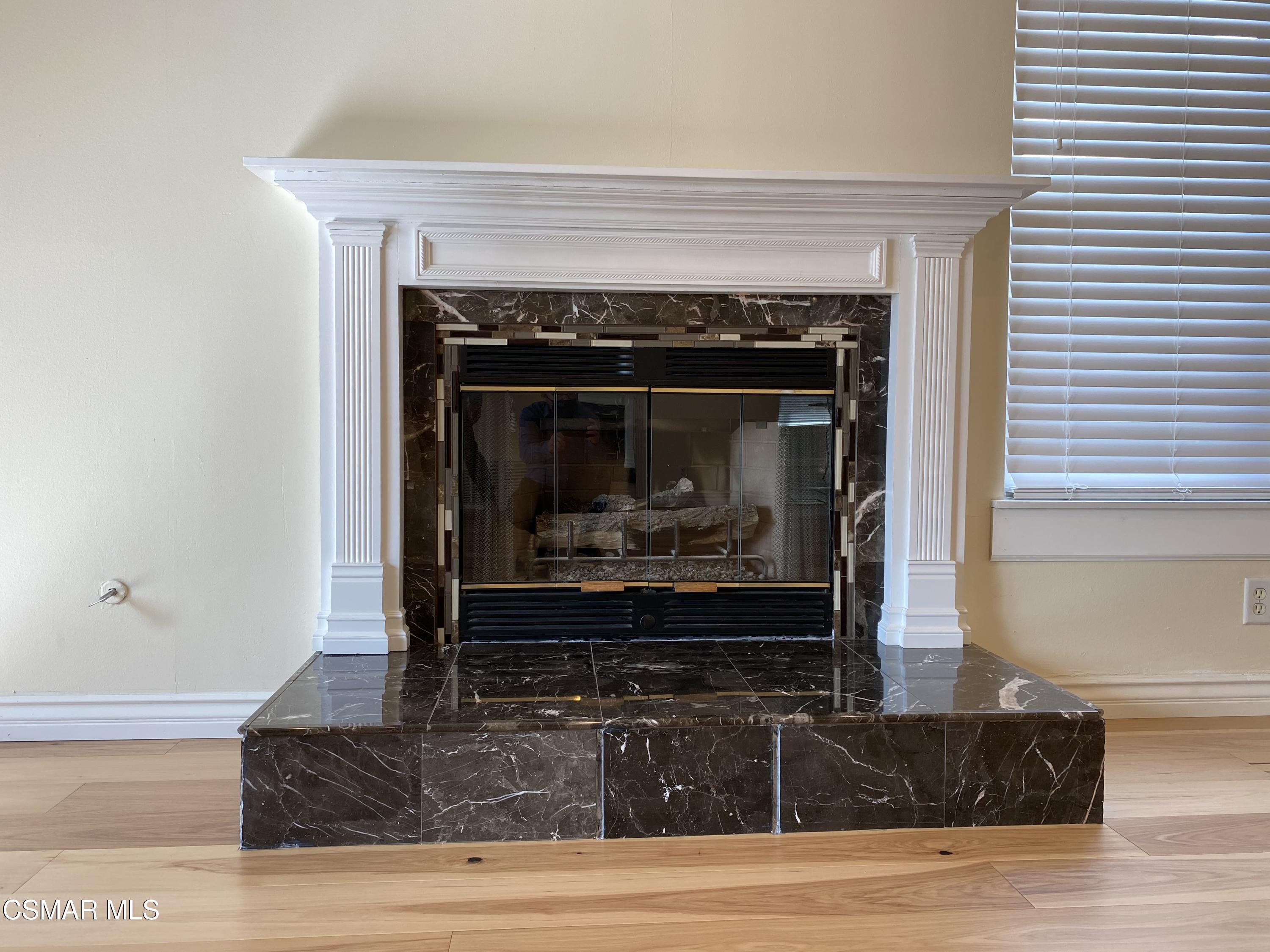 2170 Burrell Avenue Simi Valley, CA 93063 - Photo 12 of 21 a living room with fireplace and a fireplace