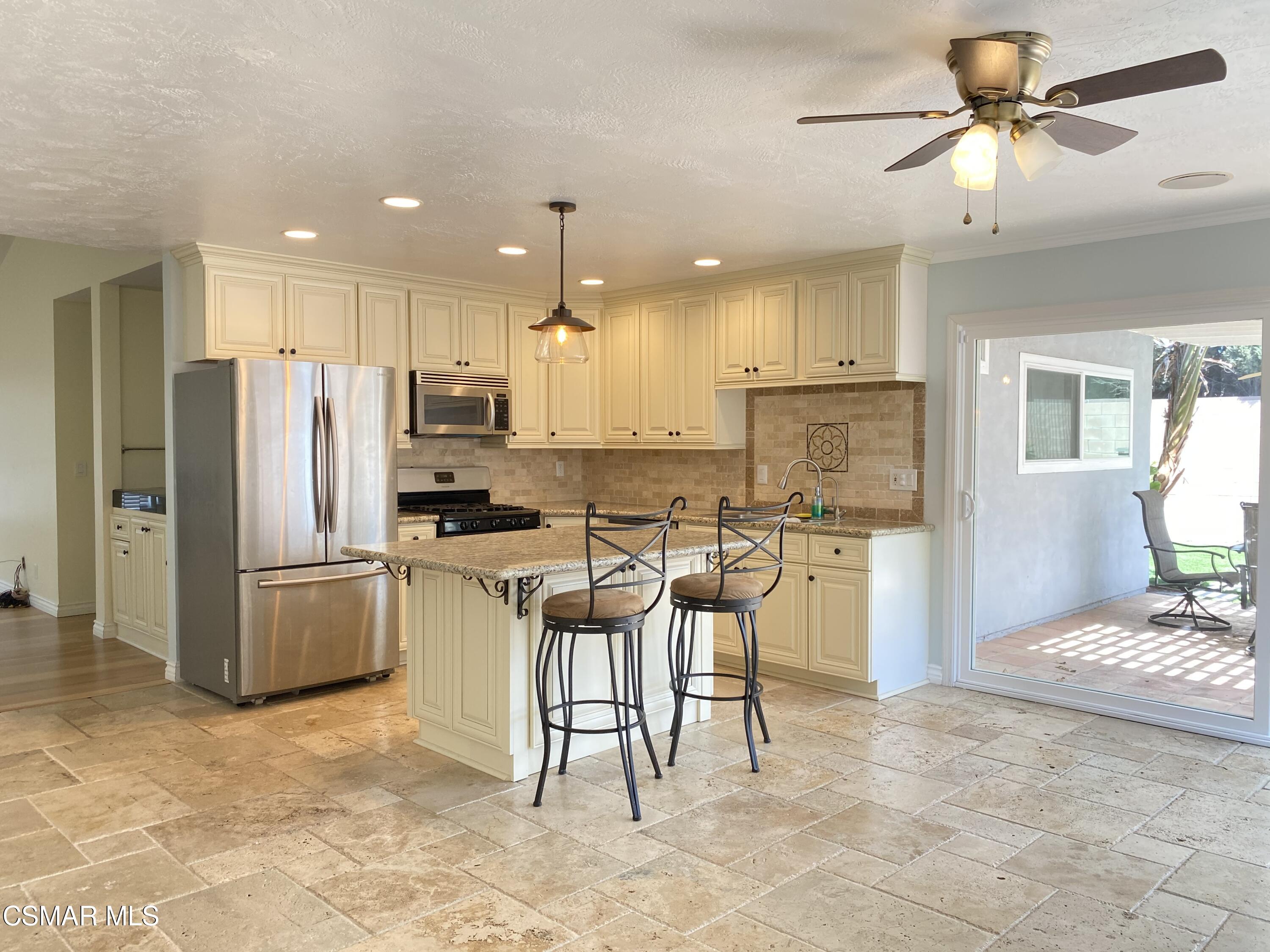 2170 Burrell Avenue Simi Valley, CA 93063 - Photo 4 of 21 a kitchen with a refrigerator and a stove top oven