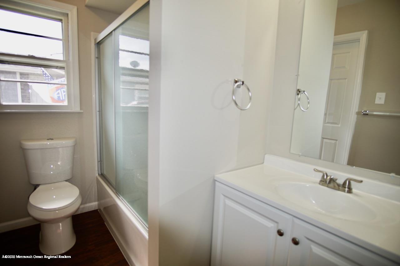 49 Markham Road Brick, NJ 08724 - Photo 11 of 13 a bathroom with a sink a toilet and a mirror