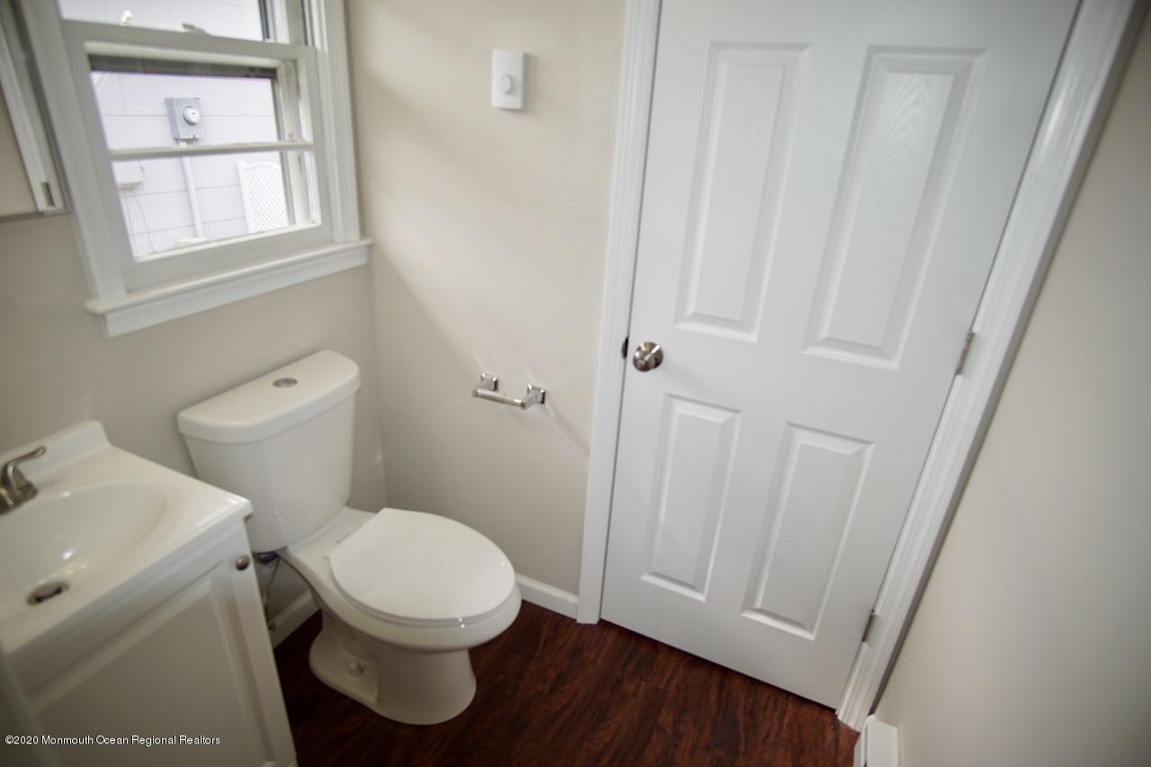 49 Markham Road Brick, NJ 08724 - Photo 9 of 13 a white toilet sitting next to a sink