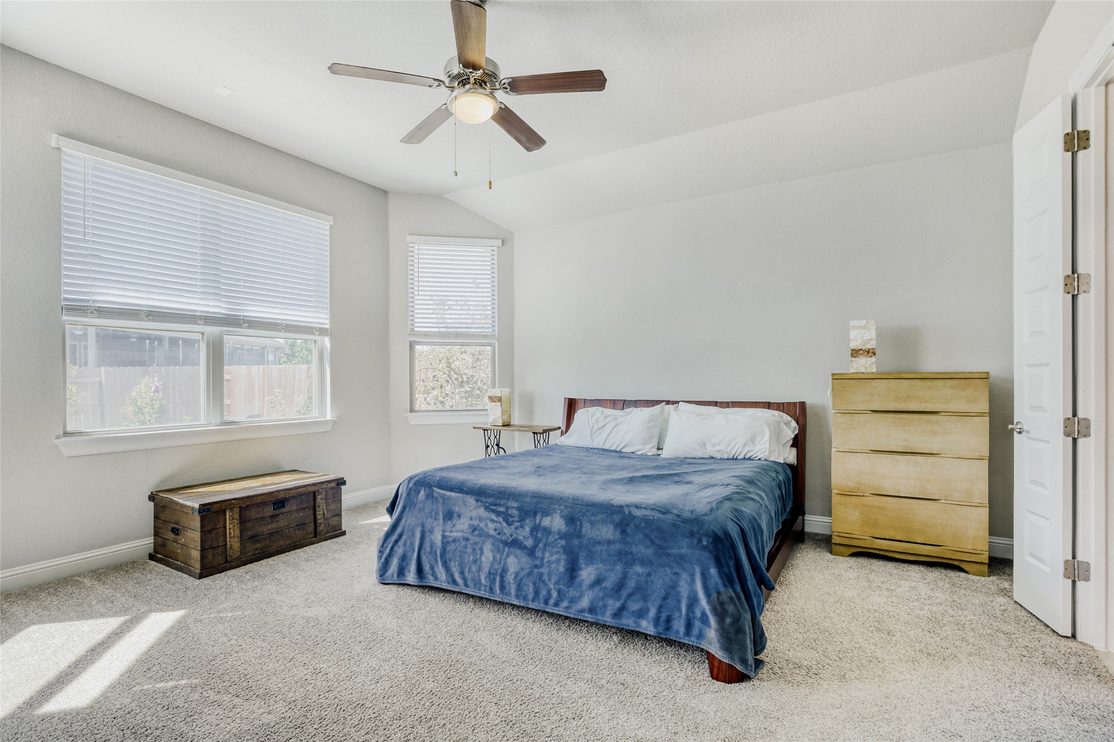 125 Buffalo View Lane Georgetown, TX 78628 - Photo 11 of 28 a spacious bedroom with a bed and a window