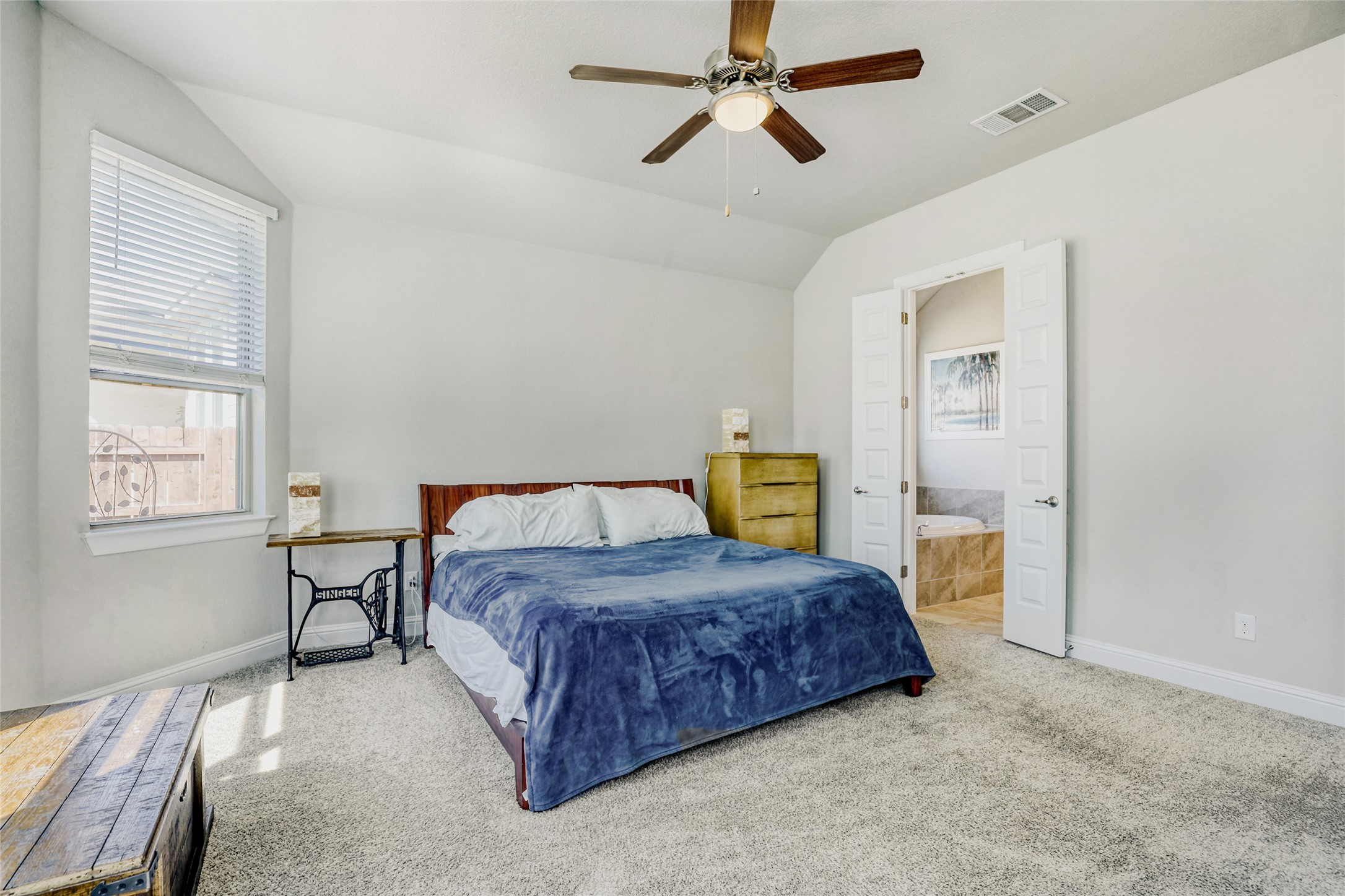 125 Buffalo View Lane Georgetown, TX 78628 - Photo 12 of 28 a bedroom with a bed and dresser