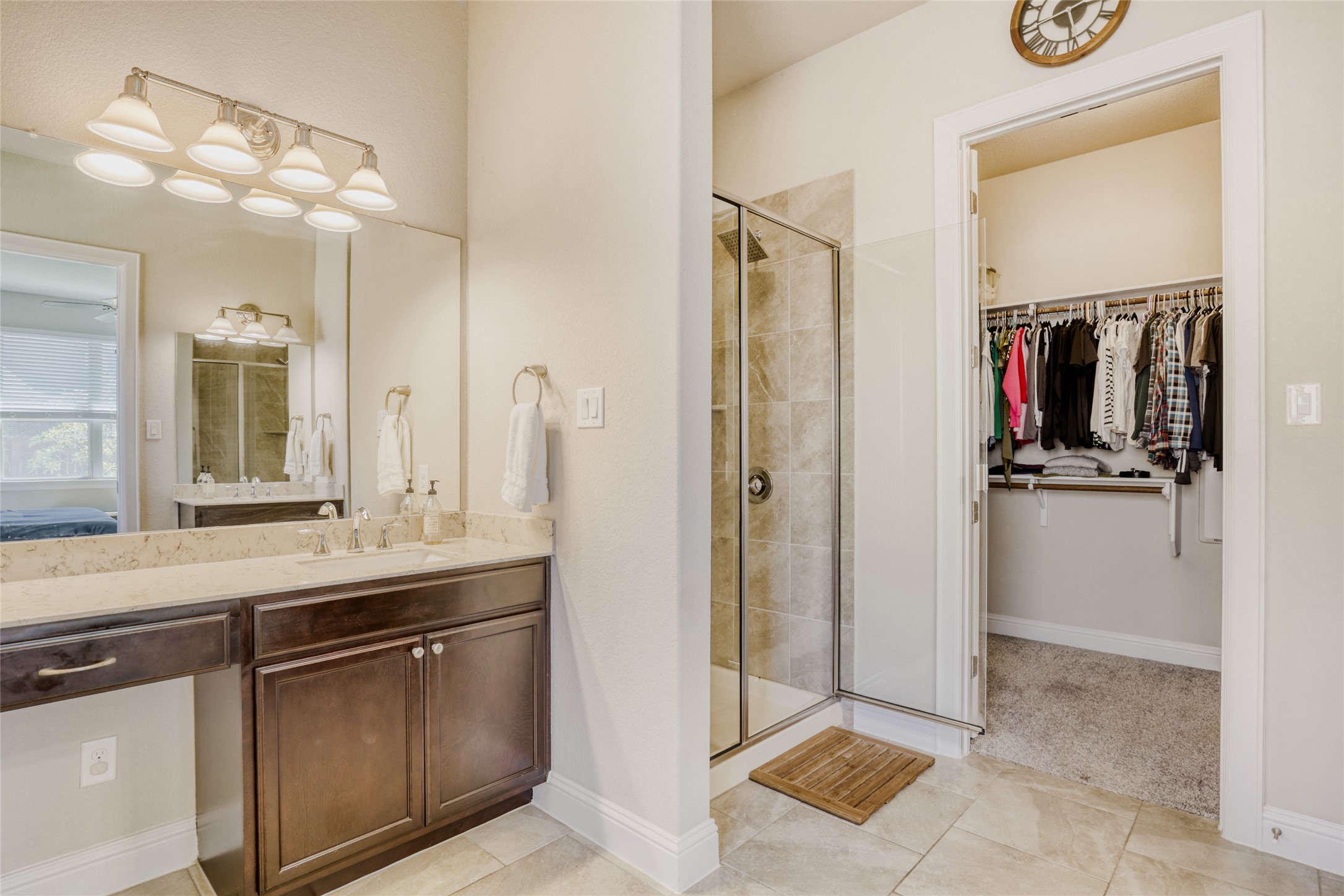 125 Buffalo View Lane Georgetown, TX 78628 - Photo 14 of 28 a view of a bathroom with a sink and mirror
