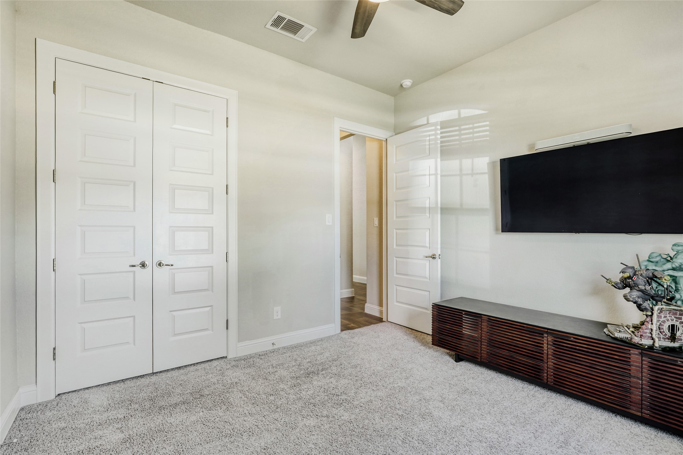 125 Buffalo View Lane Georgetown, TX 78628 - Photo 15 of 28 a spacious bedroom with a bed and a flat screen tv
