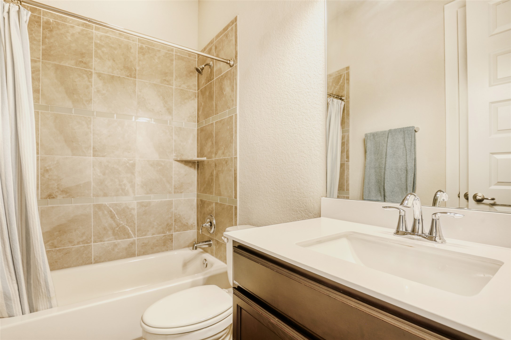 125 Buffalo View Lane Georgetown, TX 78628 - Photo 19 of 28 a bathroom with a sink a toilet and a bathtub